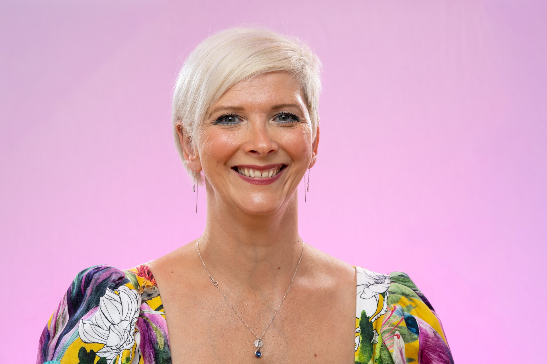 Emma Morwood portrait shot with pink bgnd